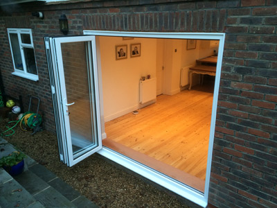 Fitting bifold doors to your home in Redhill can add so much more light and space